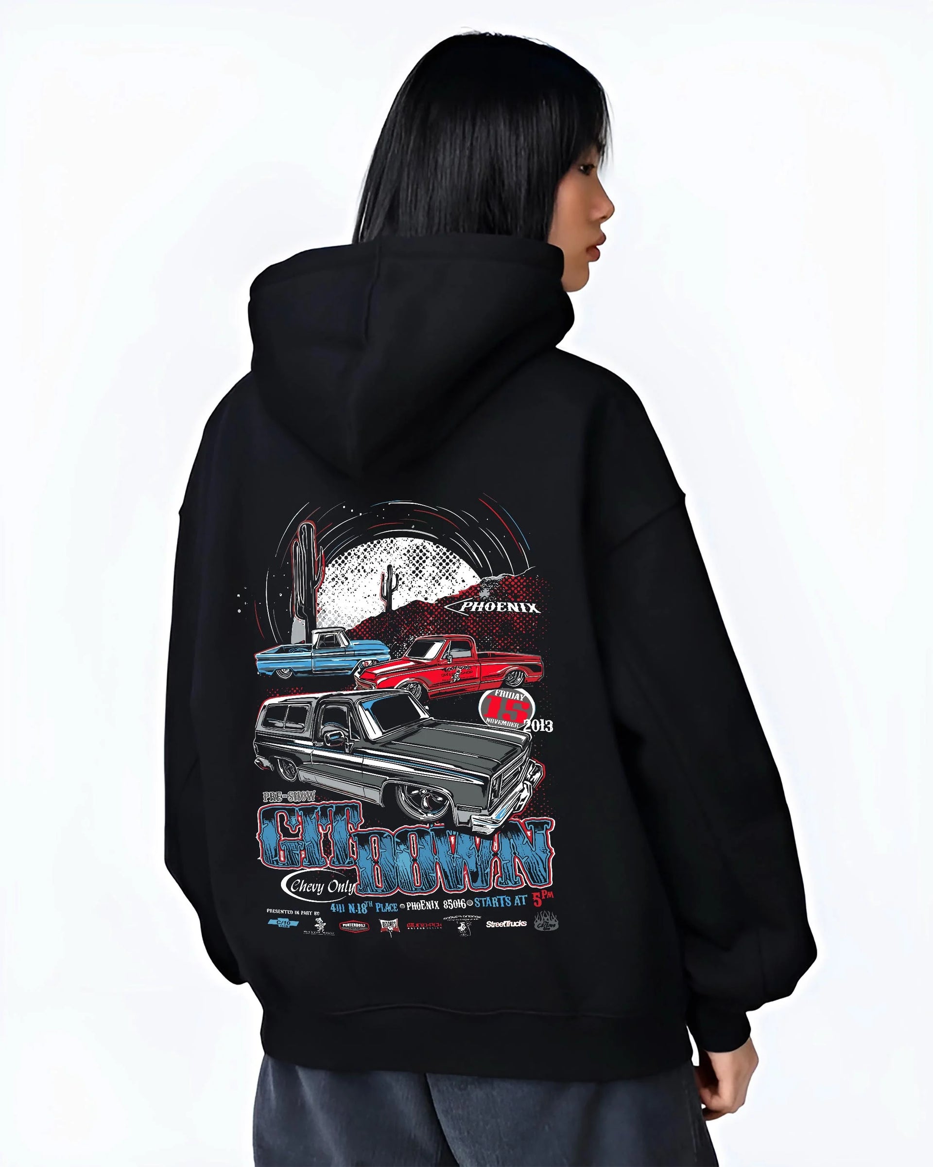 Black hoodie worn by a female model, back view, featuring Chevrolet retro vintage classic enthusiast show racing street graphic.