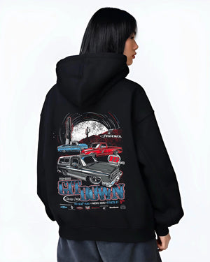 Black hoodie worn by a female model, back view, featuring Chevrolet retro vintage classic enthusiast show racing street graphic.