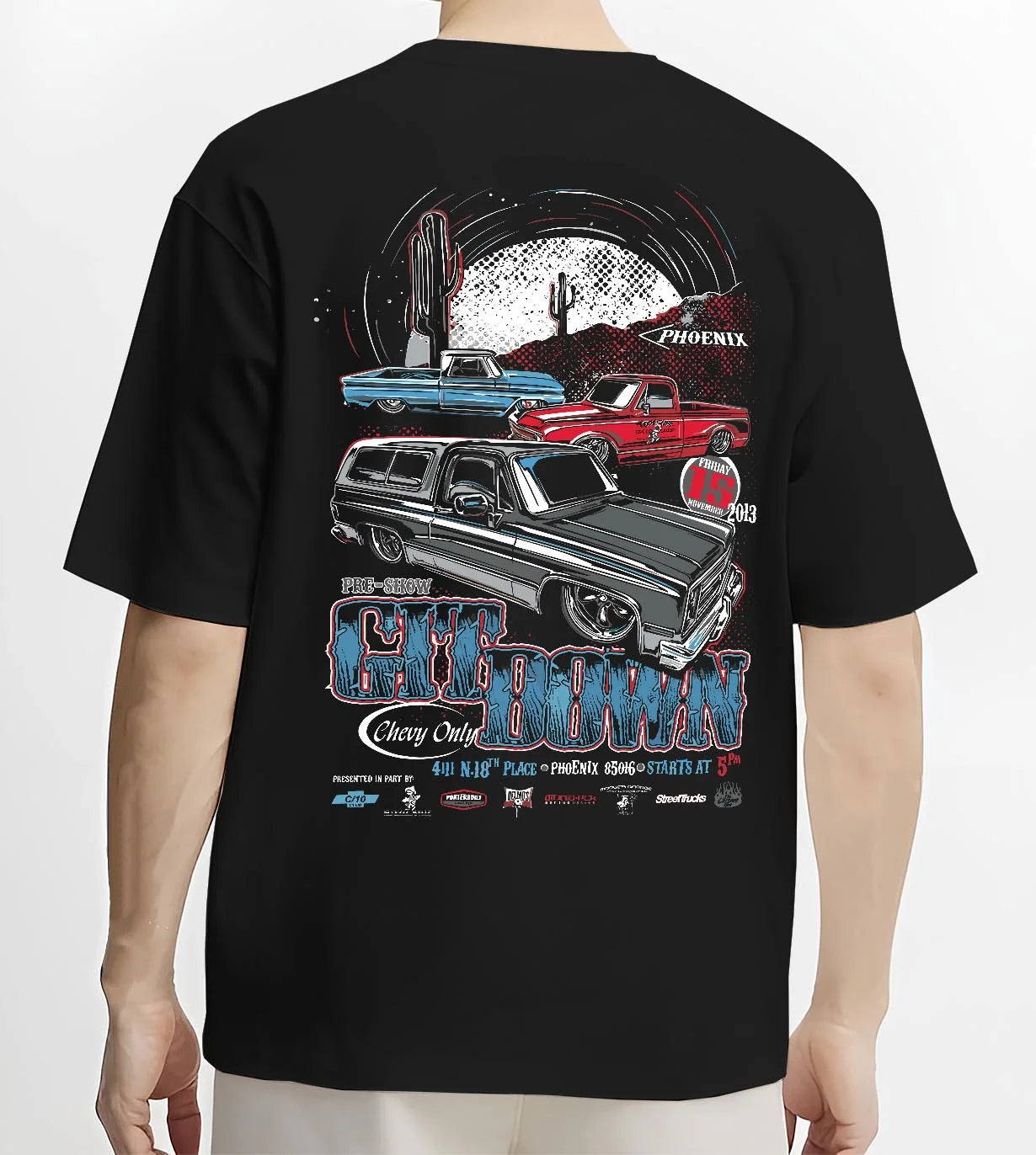 Black T-shirt worn by a male model, back view, featuring Chevrolet retro vintage classic enthusiast show racing street graphic.