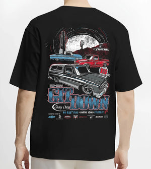 Black T-shirt worn by a male model, back view, featuring Chevrolet retro vintage classic enthusiast show racing street graphic.
