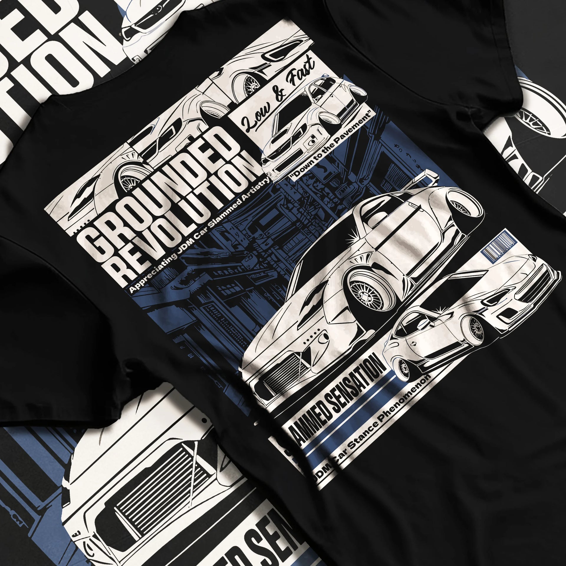 Black T-shirt laid flat with natural fabric folds, featuring EVO drift jdm japanese stance slammed street racing graphic.