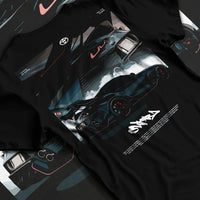 Black T-shirt laid flat with natural fabric folds, featuring Toyota Supra turbo turbocharged racing drift jdm japanese graphic.