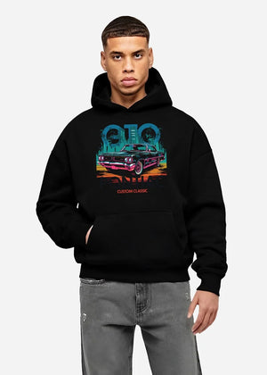 Black hoodie worn by a male model, front view, featuring Pontiac GTO muscle street retro vintage classic enthusiast graphic.