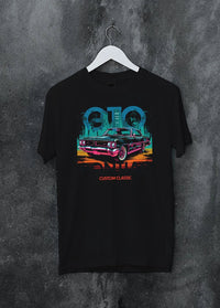 Black crewneck T-shirt on a hanger against a grey wall, featuring Pontiac GTO muscle street retro vintage classic graphic.