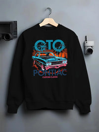 Black crewneck sweatshirt on a hanger against a grey wall, featuring Pontiac GTO muscle street retro vintage classic graphic.