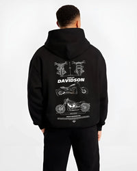 Black hoodie worn by a male model, back view, featuring Harley-Davidson Fxdr street retro enthusiast racing performance graphic.