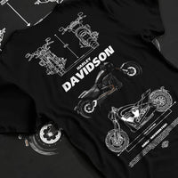 Black T-shirt laid flat with natural fabric folds, featuring Harley-Davidson Fxdr street retro enthusiast racing graphic.