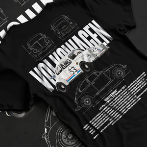Black T-shirt laid flat with natural fabric folds, featuring Volkswagen Beetle racing classic legend street performance graphic.