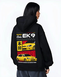 Black hoodie worn by a female model, back view, featuring Honda Civic racing jdm japanese street iconic performance graphic.