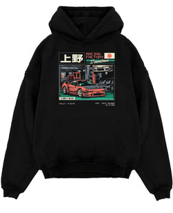 Black pullover hoodie laid flat on a white background, featuring Honda rs racing motorsport street retro classic speed graphic.