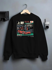 Black crewneck sweatshirt on a hanger against a grey wall, featuring Honda rs racing motorsport street retro classic speed graphic.