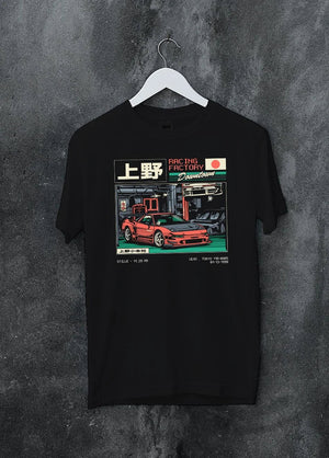 Black crewneck T-shirt on a hanger against a grey wall, featuring Honda rs racing motorsport street retro classic speed graphic.