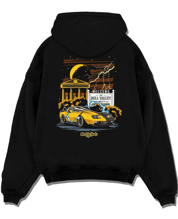 Black pullover hoodie laid flat on a white background, featuring racing street retro performance motorsport automotive graphic.
