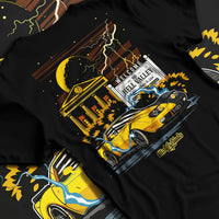 Black T-shirt laid flat with natural fabric folds, featuring racing street retro performance motorsport automotive graphic.