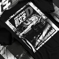 Black T-shirt laid flat with natural fabric folds, featuring racing drift jdm japanese initial d street legend performance graphic.