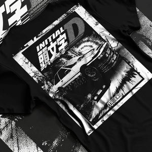 Black T-shirt laid flat with natural fabric folds, featuring racing drift jdm japanese initial d street legend performance graphic.