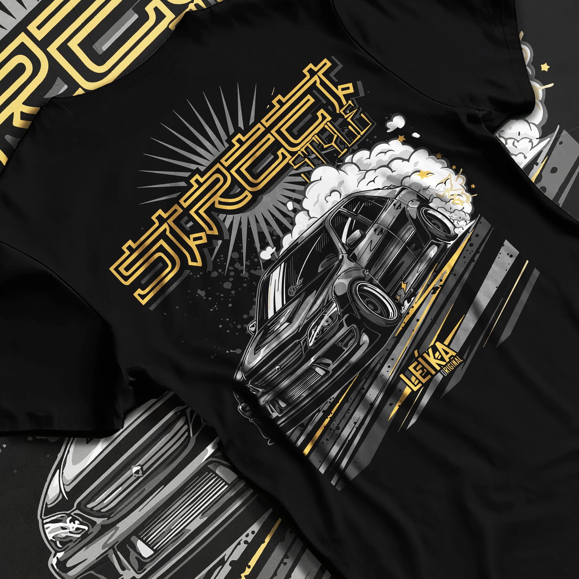 Black T-shirt laid flat with natural fabric folds, featuring Lexus rs drift tuner street enthusiast racing performance graphic.