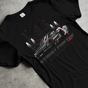 Black T-shirt laid flat with natural fabric folds, featuring rs racing drift jdm tuner street enthusiast performance graphic.