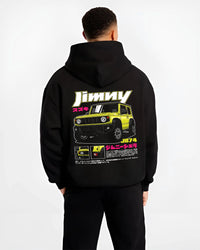 Black hoodie worn by a male model, back view, featuring Suzuki japanese racing street performance motorsport automotive graphic.