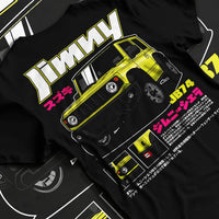 Black T-shirt laid flat with natural fabric folds, featuring Suzuki japanese racing street performance motorsport graphic.