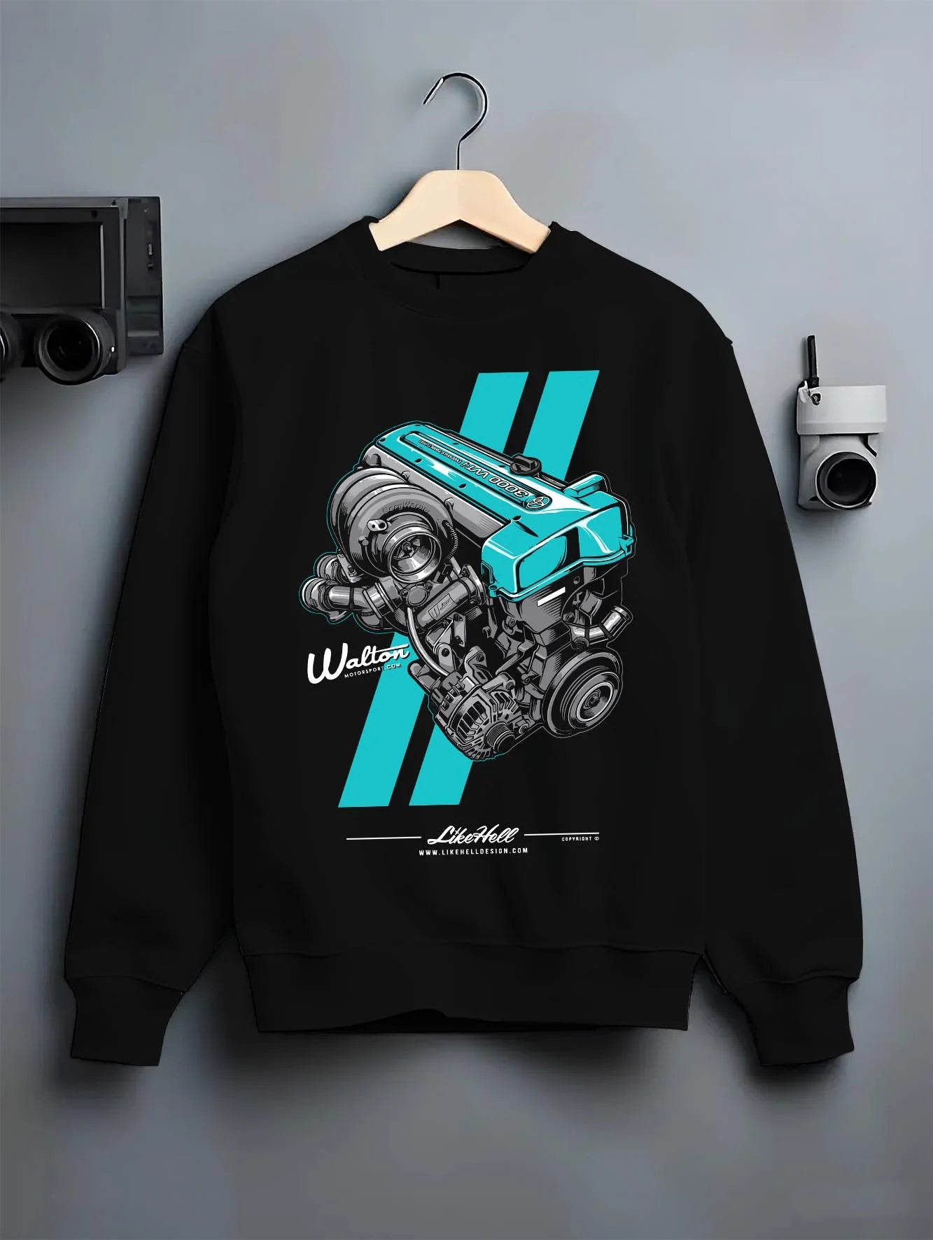 Black crewneck sweatshirt on a hanger against a grey wall, featuring Toyota turbo 2jz drift jdm japanese tuner enthusiast graphic.