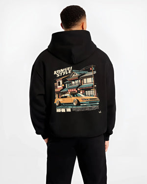 Black hoodie worn by a male model, back view, featuring racing drift jdm japanese street performance motorsport automotive kansei.