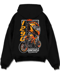 Black pullover hoodie laid flat on a white background, featuring KTM racing street performance motorsport automotive graphic.