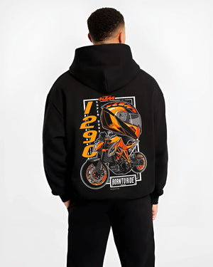 Black hoodie worn by a male model, back view, featuring KTM racing street performance motorsport automotive enthusiast graphic.