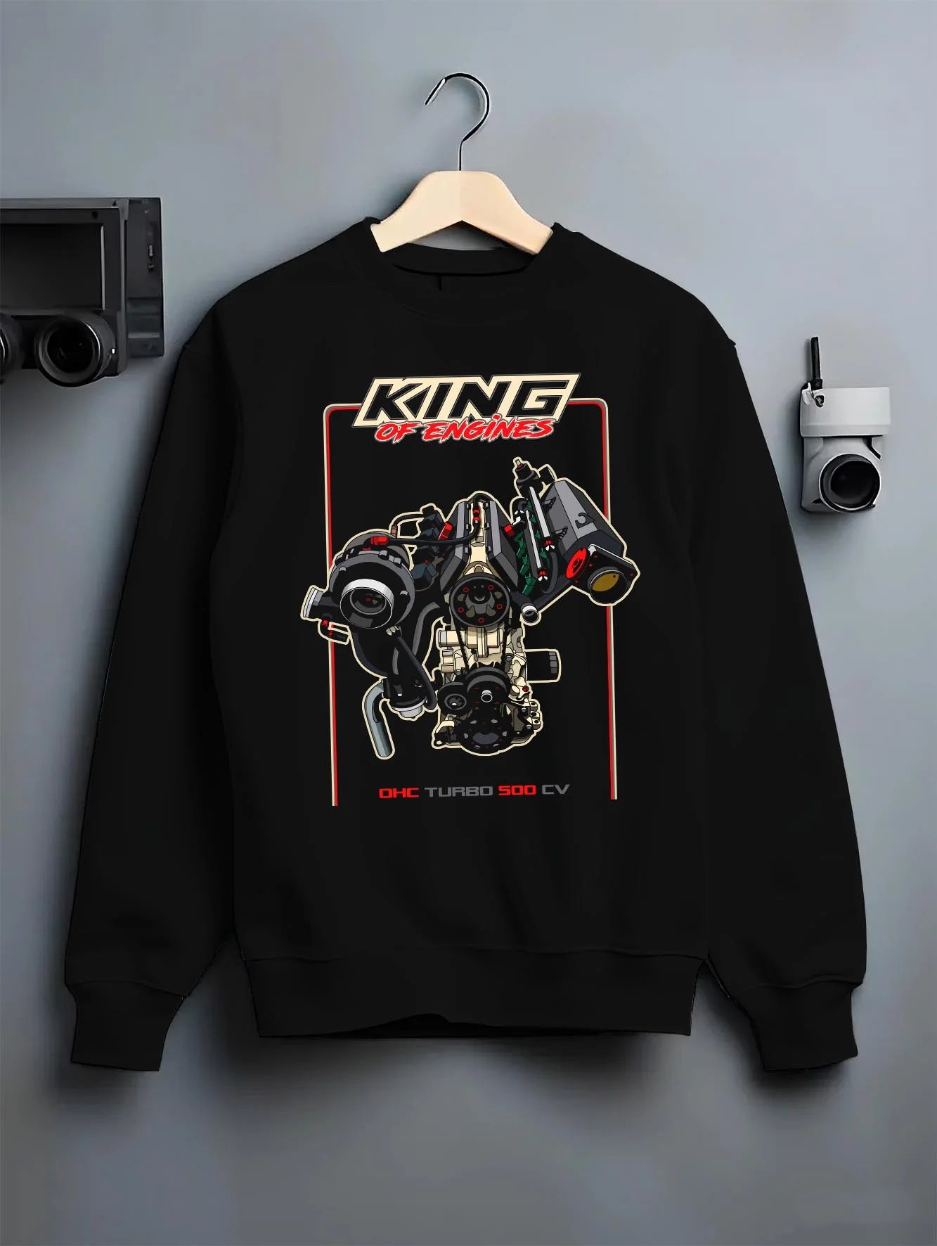 Black crewneck sweatshirt on a hanger against a grey wall, featuring rs turbo racing street power performance motorsport graphic.