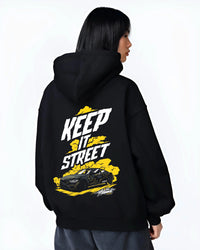 Black hoodie worn by a female model, back view, featuring turbo racing drift tuner street performance motorsport automotive graphic.