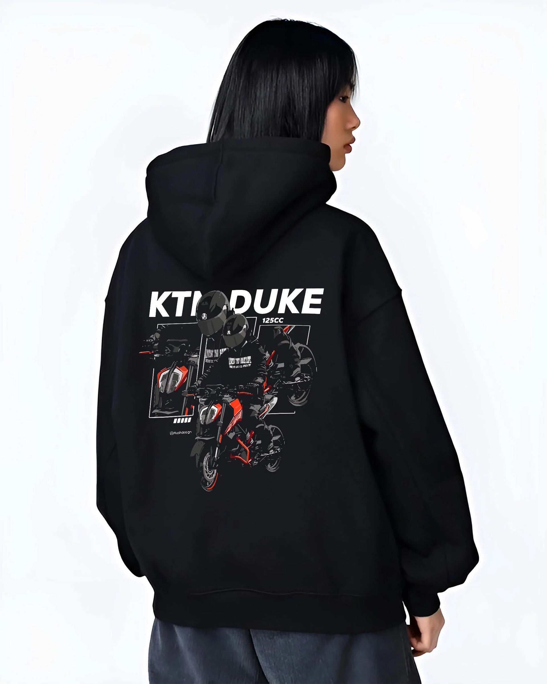 Black hoodie worn by a female model, back view, featuring KTM rs racing street performance motorsport automotive enthusiast graphic.