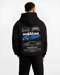 Black hoodie worn by a male model, back view, featuring SKYLINE racing street performance motorsport automotive enthusiast graphic.