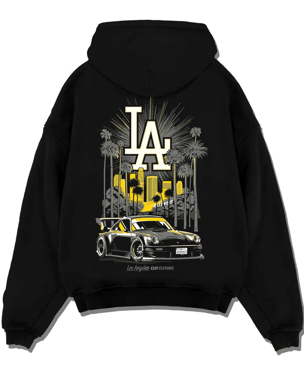 Black pullover hoodie laid flat on a white background, featuring racing street performance motorsport automotive enthusiast larun.