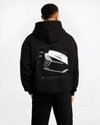 Black hoodie worn by a male model, back view, featuring SKYLINE street racing performance motorsport automotive enthusiast graphic.