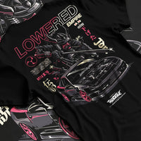 Black T-shirt laid flat with natural fabric folds, featuring drift drifting japanese tuner lowered street racing graphic.