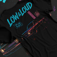 Black T-shirt laid flat with natural fabric folds, featuring street retro classic racing performance motorsport automotive graphic.