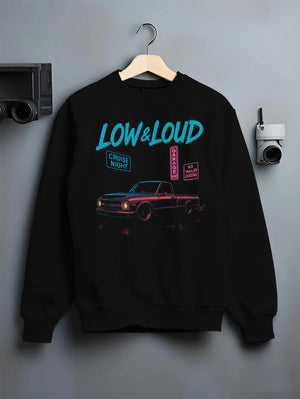 Black crewneck sweatshirt on a hanger against a grey wall, featuring street retro classic racing performance motorsport graphic.