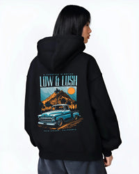 Black hoodie worn by a female model, back view, featuring Chevrolet retro classic racing street performance motorsport graphic.