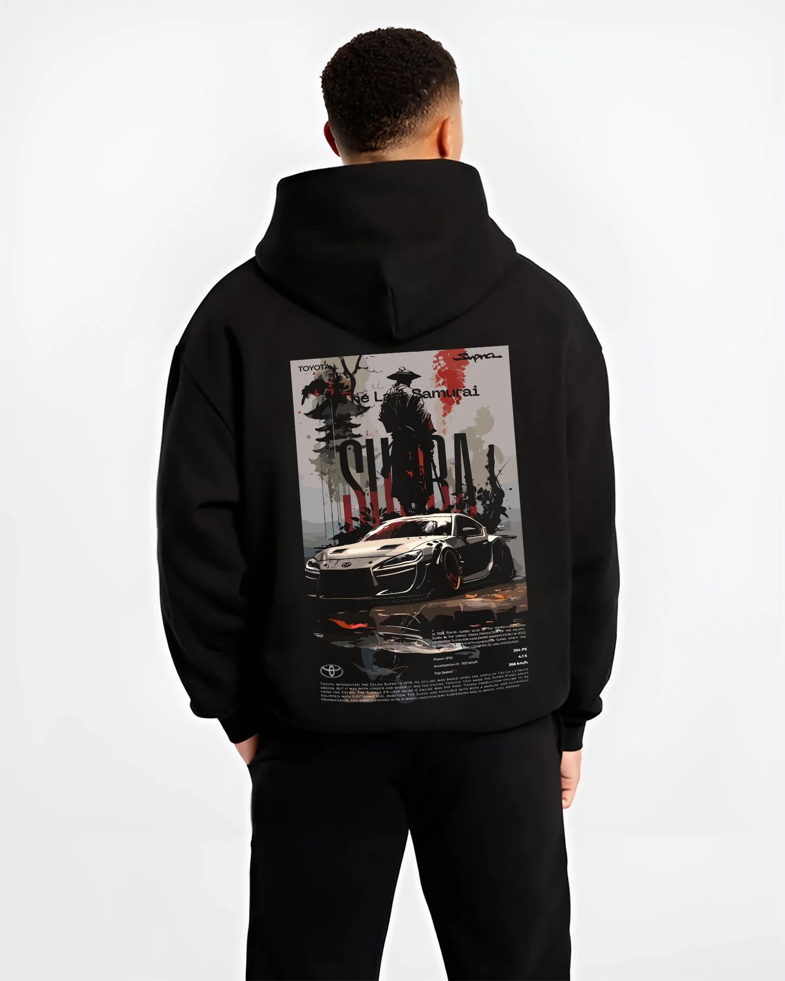 Black hoodie worn by a male model, back view, featuring Toyota Supra racing jdm japanese tuning street enthusiast graphic.