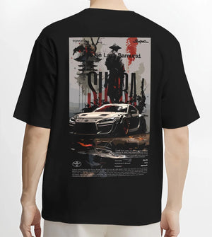 Black T-shirt worn by a male model, back view, featuring Toyota Supra racing jdm japanese tuning street enthusiast graphic.