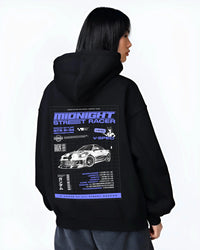 Black hoodie worn by a female model, back view, featuring NISSAN SKYLINE r34 racing race drift jdm japanese street midnight graphic.