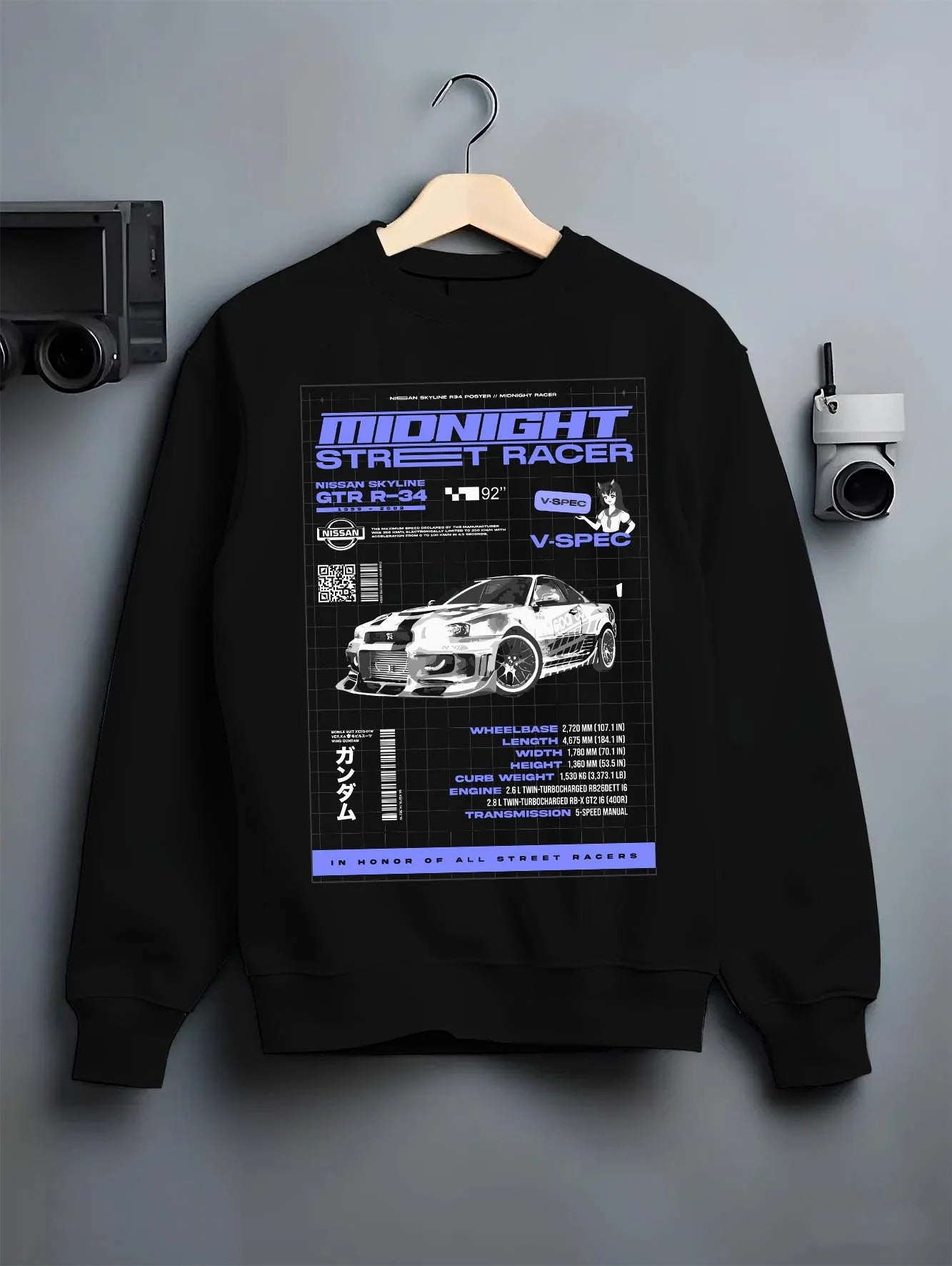Black crewneck sweatshirt on a hanger against a grey wall, featuring NISSAN SKYLINE r34 racing race drift jdm japanese graphic.