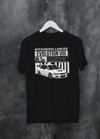 Black crewneck T-shirt on a hanger against a grey wall, featuring street retro vintage racing performance motorsport graphic.
