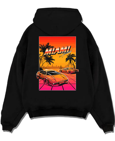 Black pullover hoodie laid flat on a white background, featuring street retro racing performance motorsport automotive miams1.