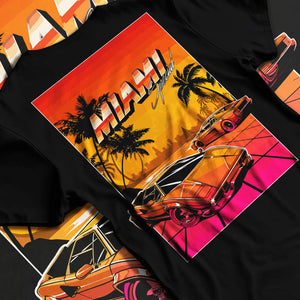 Black T-shirt laid flat with natural fabric folds, featuring street retro racing performance motorsport automotive miams1.