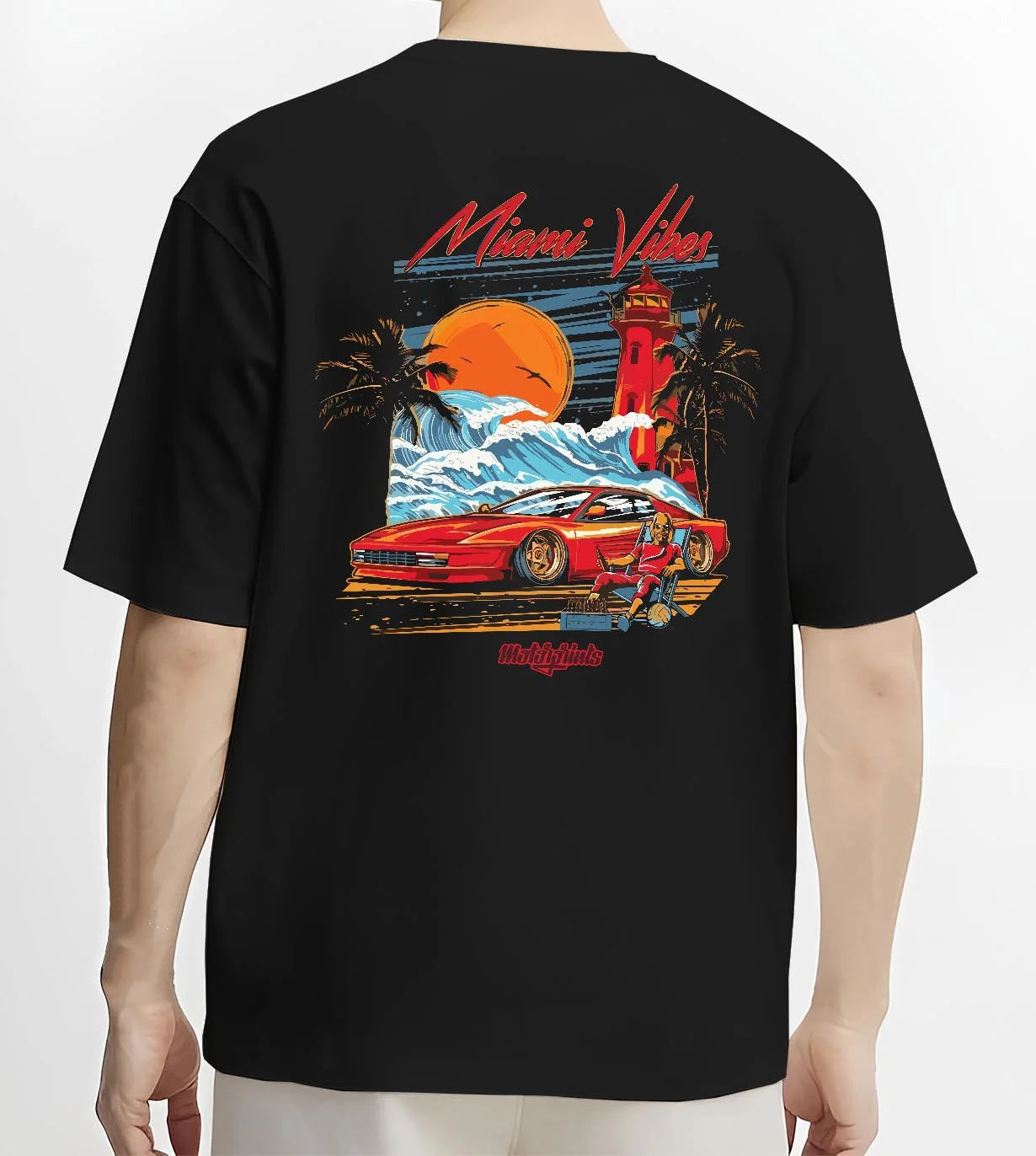 Black T-shirt worn by a male model, back view, featuring street retro racing performance motorsport automotive enthusiast miamv1.
