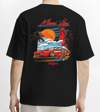 Black T-shirt worn by a male model, back view, featuring street retro racing performance motorsport automotive enthusiast miamv1.