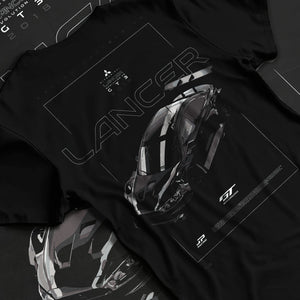 Black T-shirt laid flat with natural fabric folds, featuring Mitsubishi EVO turbo turbocharged racing drift jdm japanese graphic.