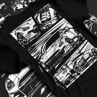 Black T-shirt laid flat with natural fabric folds, featuring Nissan GT-R gt r racing drift jdm japanese street graphic.