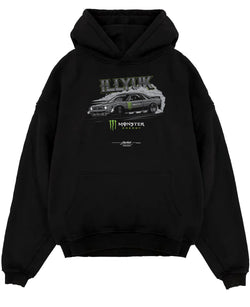 Black pullover hoodie laid flat on a white background, featuring rs turbo racing drift motorsport tuner street monster graphic.